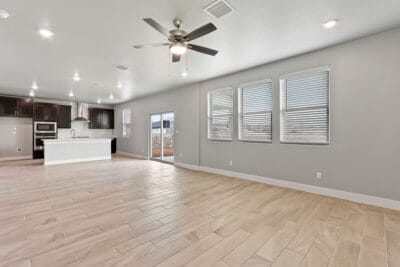 Modern kitchen and open living area of Zen floorplan home in El Paso.